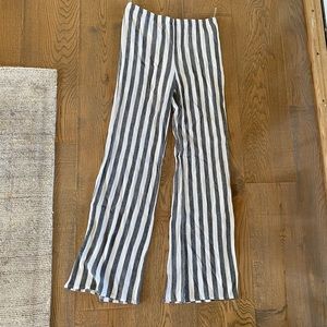 Long striped gray and white pants.